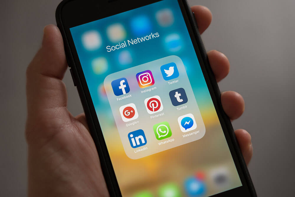 Social media icons on a phone.